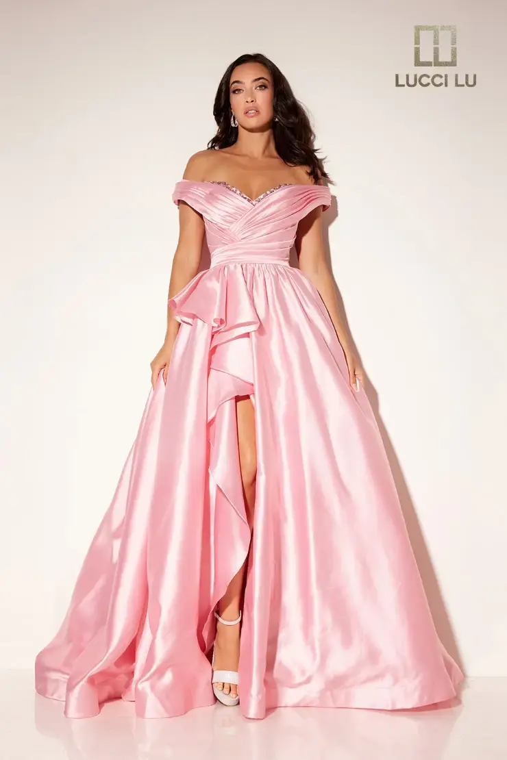 model is wearing an off the shoulder pink ball gown dress