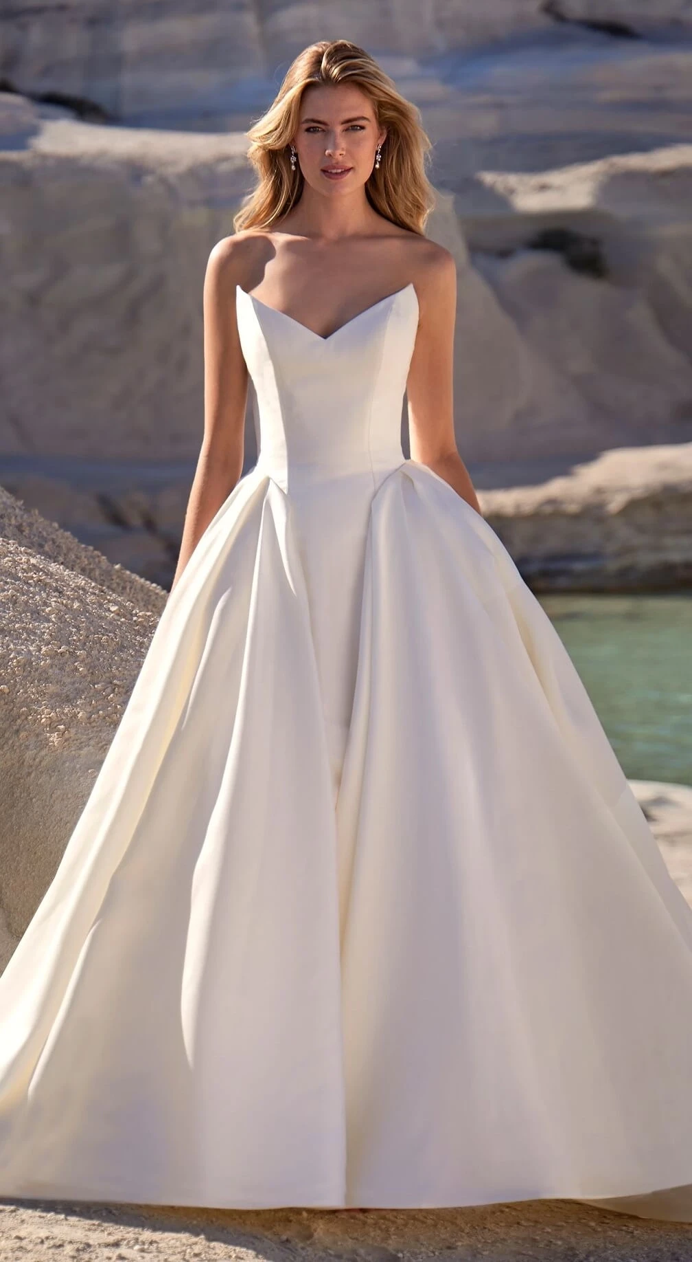 Photo of the model wearing a white bridal gown